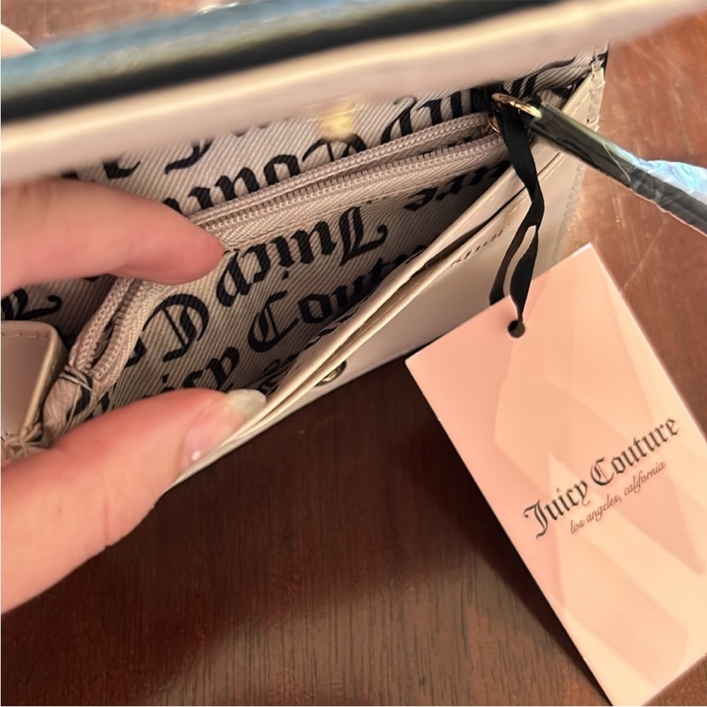 Juicy Couture Flawless Slim Elongated
Licorice Bifold - Picture 9 of 10